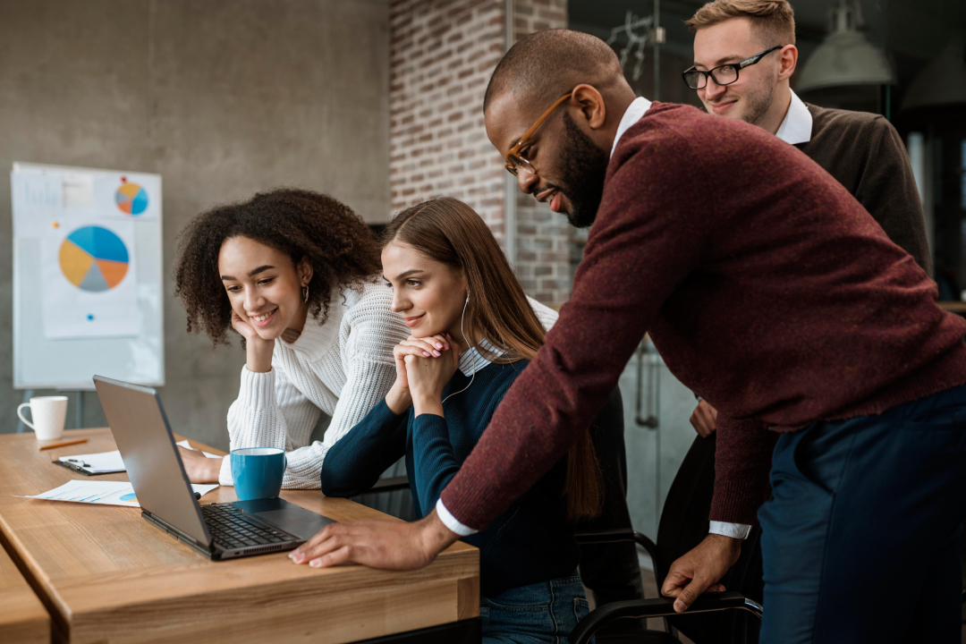 woman-showing-something-her-colleagues-during-meeting (1)